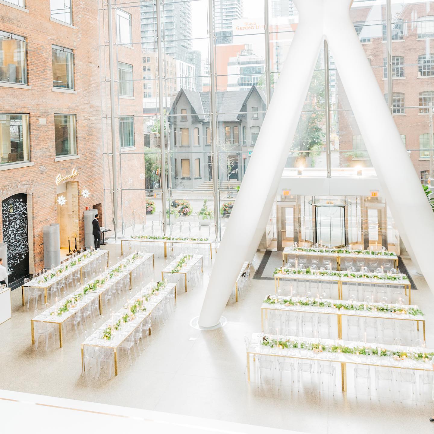 A sun-bathed restaurant in Toronto with dozens of place settings